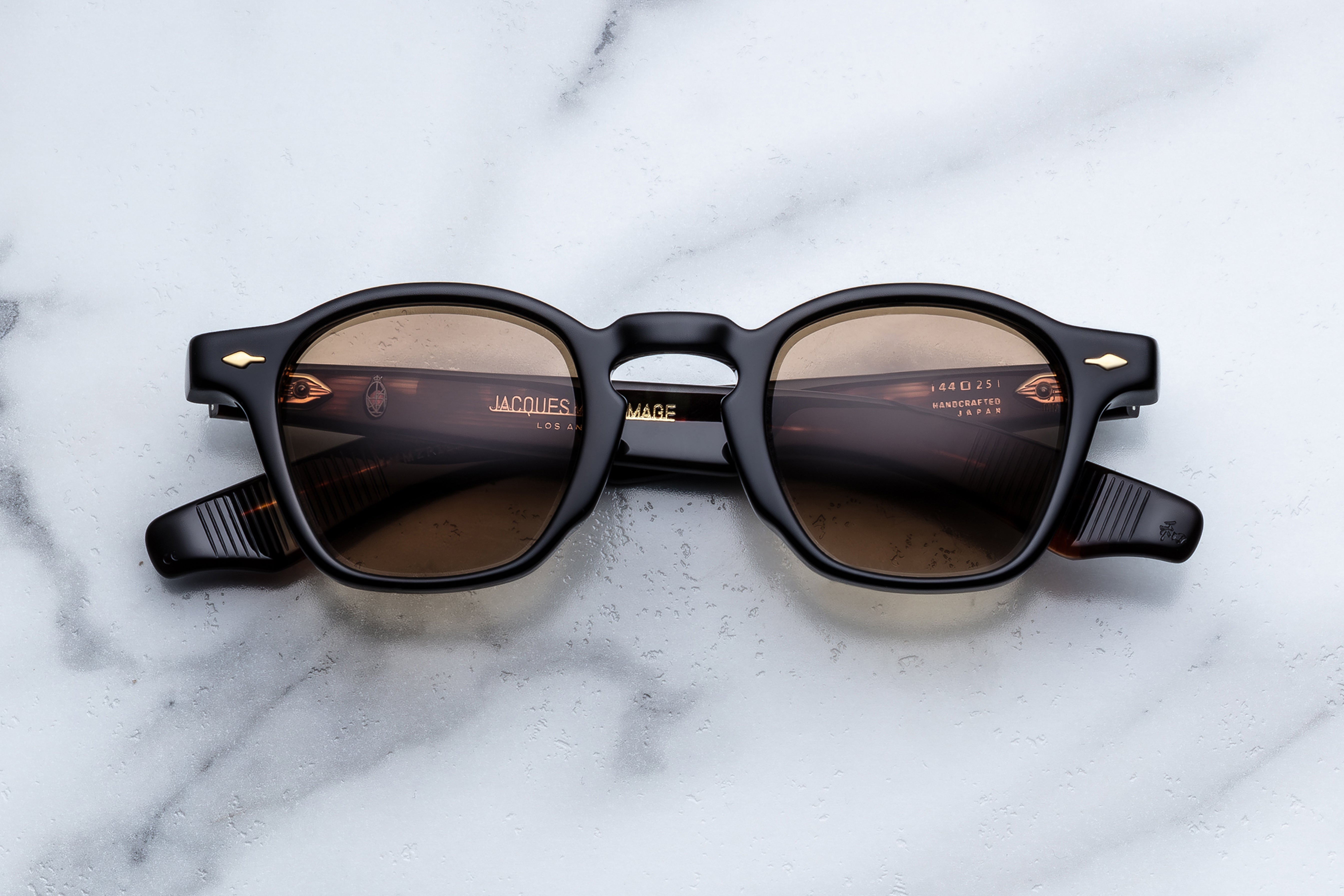 Jacques Marie Mage Zephirin sunglasses in black with rounded frames, front view showing sleek design and tinted lenses.