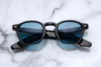 Jacques Marie Mage Zephirin Noir sunglasses with round frames and dark lenses, front view showing sleek, stylish design.
