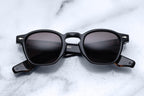 Jacques Marie Mage Zephirin sunglasses with black frames, front view showcasing modern design and sleek style.