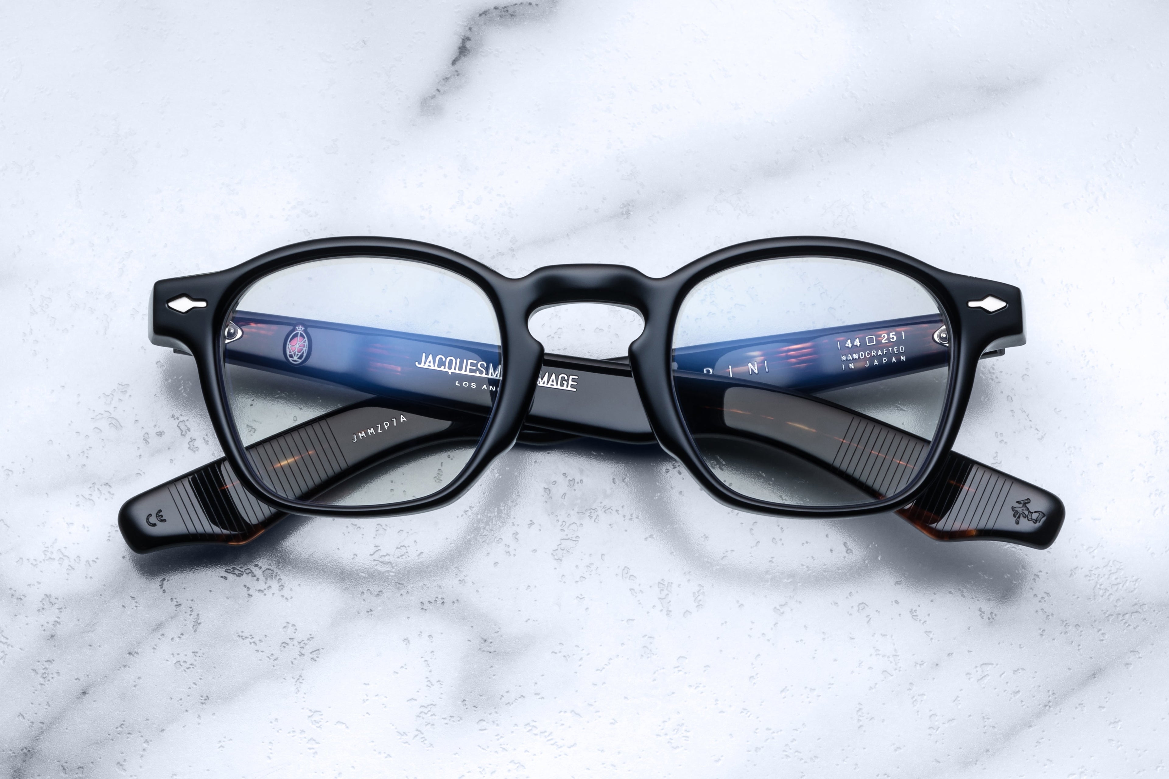 Jacques Marie Mage Zephirin Noir optical glasses with round black frames and clear lenses, front view.