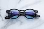 Jacques Marie Mage Zephirin sunglasses with dark tinted lenses and sleek black frame, front view.
