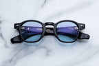 Jacques Marie Mage Zephirin sunglasses with dark tinted lenses and sleek black frames, front view showing stylish design.