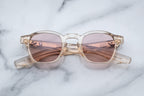 Jacques Marie Mage Zephirin sunglasses with pearl-colored frames and clear lenses, shown from the front view.