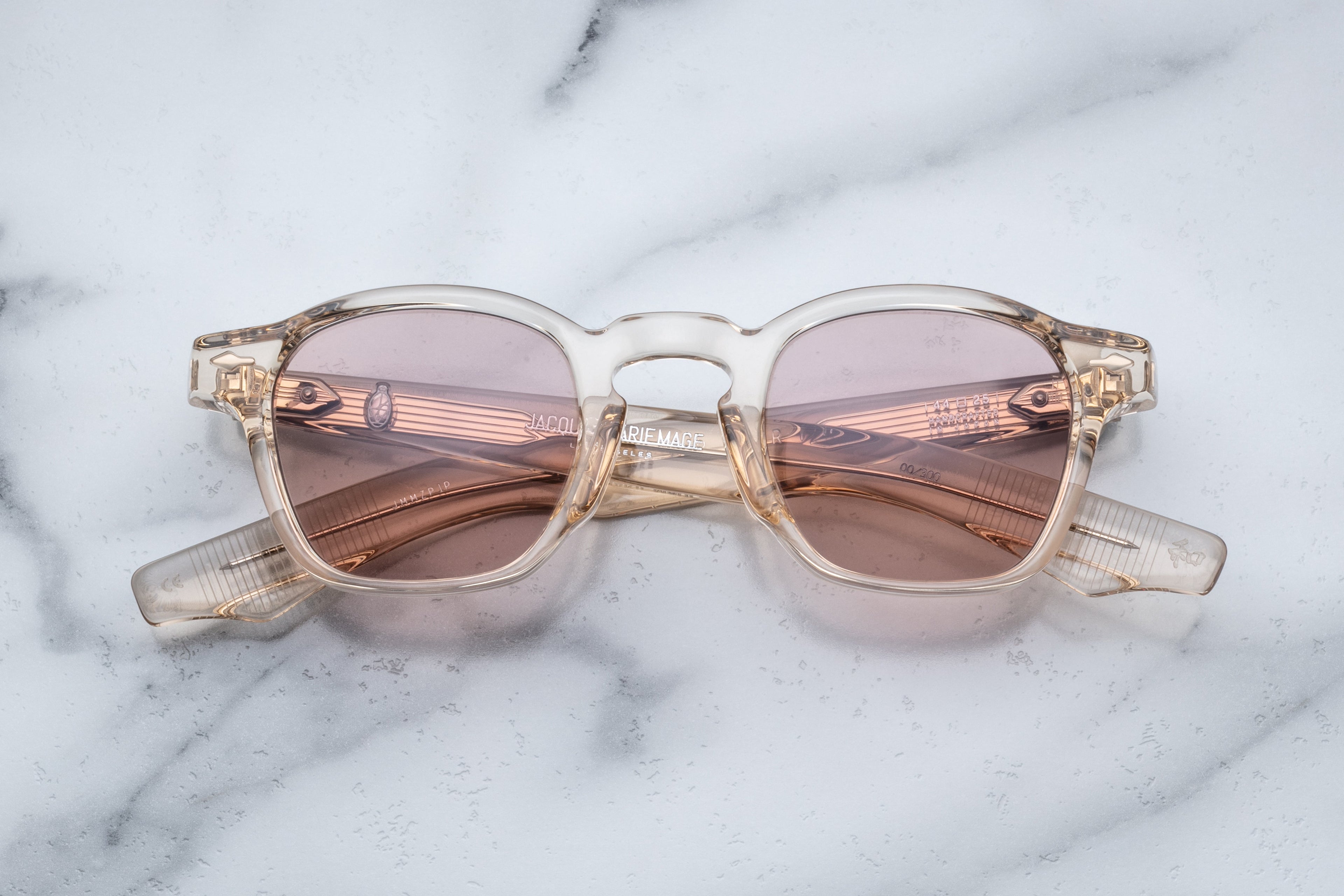 Jacques Marie Mage Zephirin sunglasses with pearl-colored frames and clear lenses, shown from the front view.