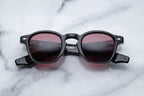 Jacques Marie Mage Zephirin sunglasses with rounded frames and dark tinted lenses, front view showing stylish design.