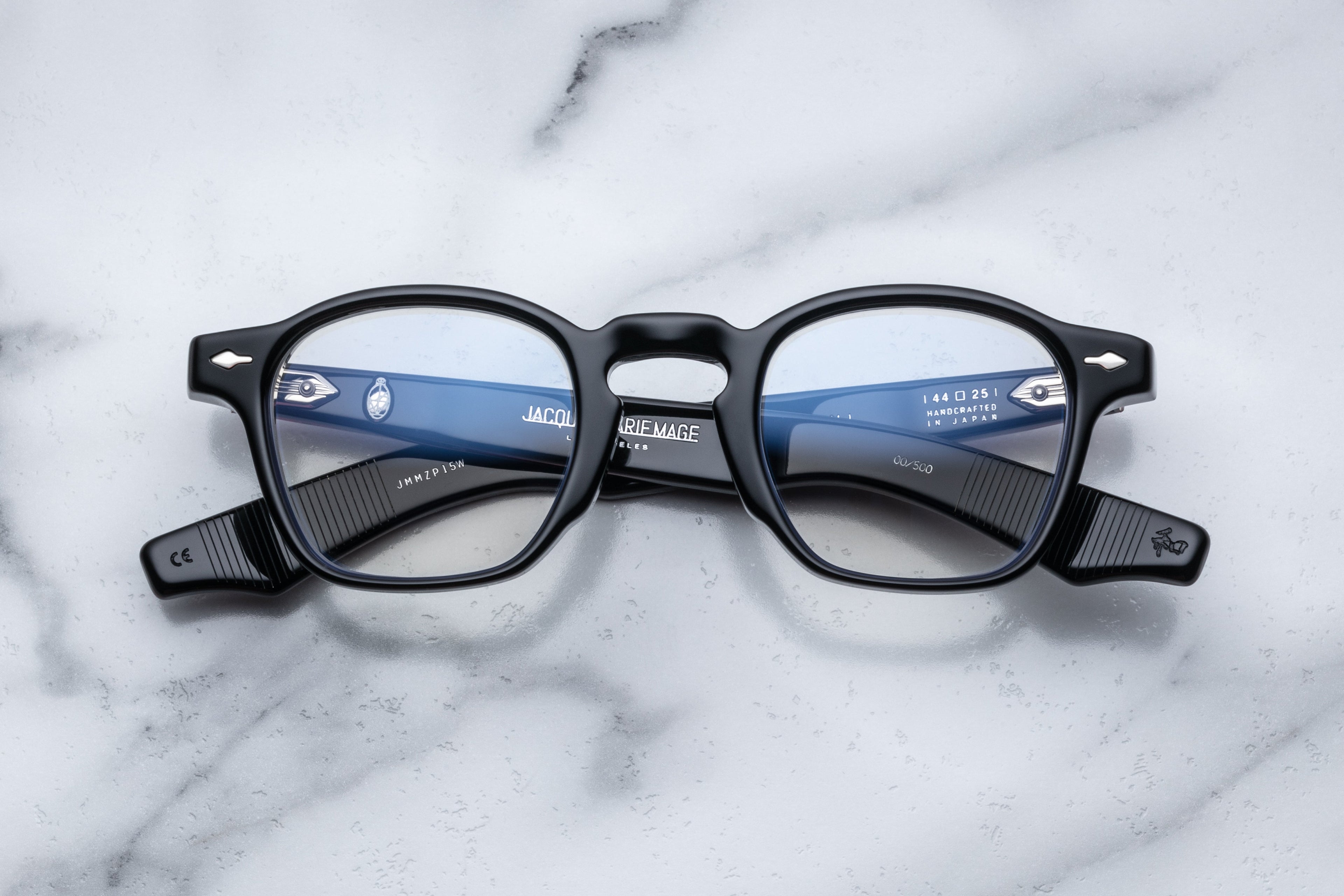 Jacques Marie Mage Zephirin Saber RX optical glasses with clear lenses and sleek black frame, front view.