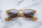 Jacques Marie Mage Zephirin sunglasses with saffron-colored frames, front view showing sleek, modern design and tinted lenses.