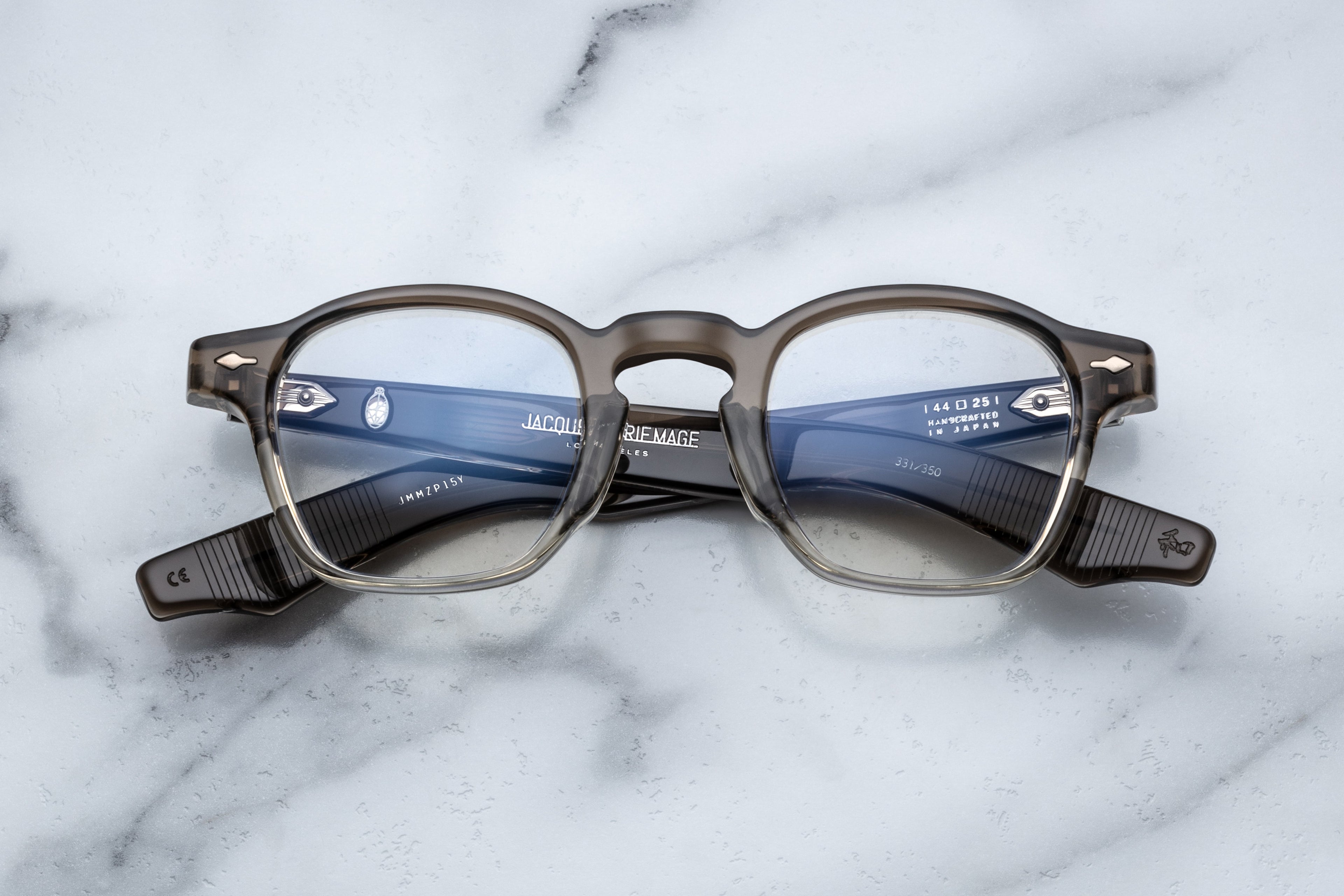 Jacques Marie Mage Zephirin Smoke Fade optical glasses with clear lenses, featuring a sleek, modern frame design.