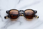 Jacques Marie Mage Zephirin sunglasses with dark tinted lenses and stylish frame, front view image.