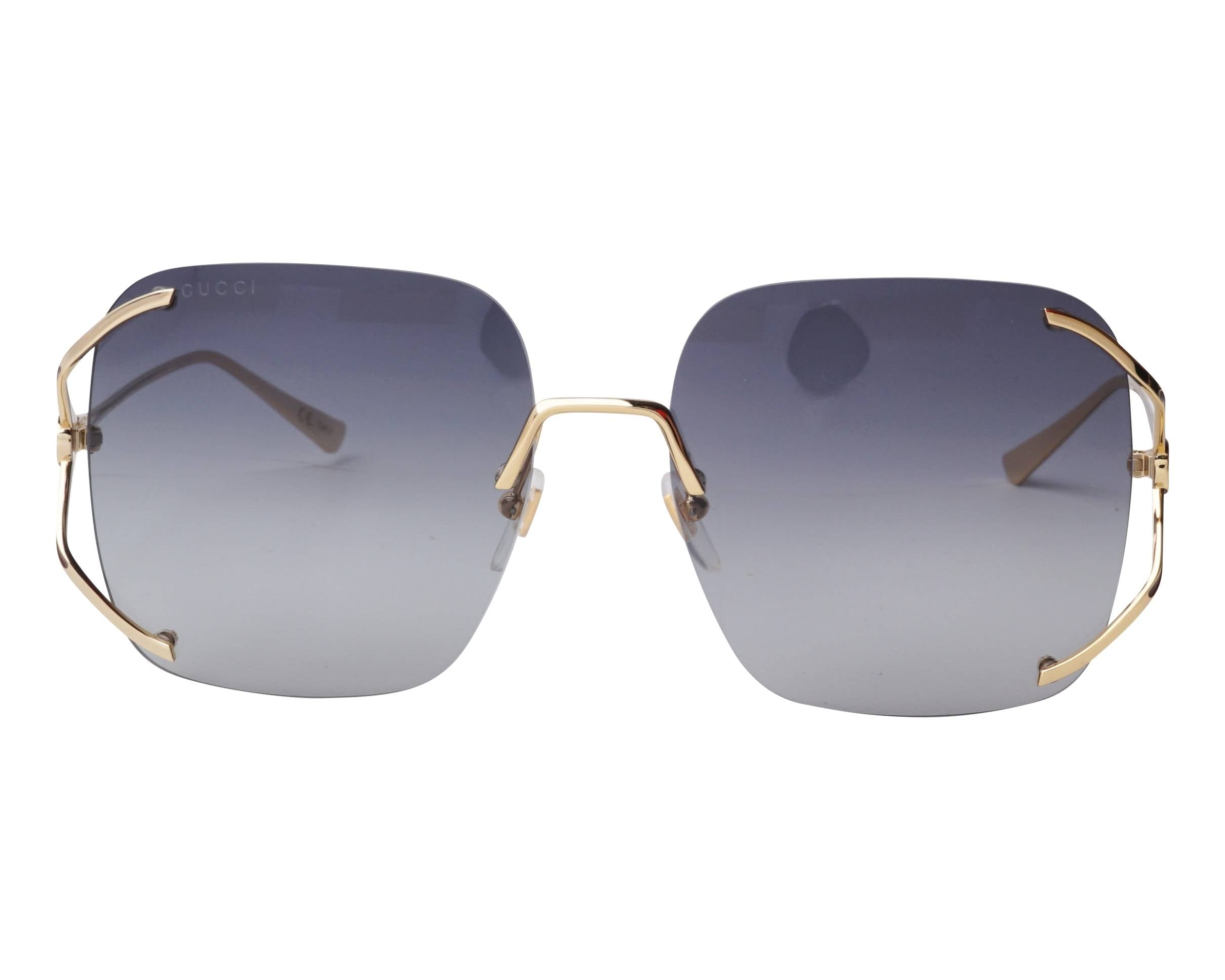 Gucci GG0646S sunglasses with black frames and dark lenses, stylish and modern accessory for outdoor wear