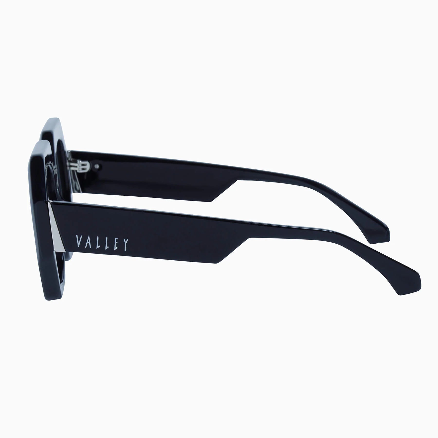 Valley Eyewear Monolith sunglasses with glossy black frames and clear lenses, stylish and modern design.
