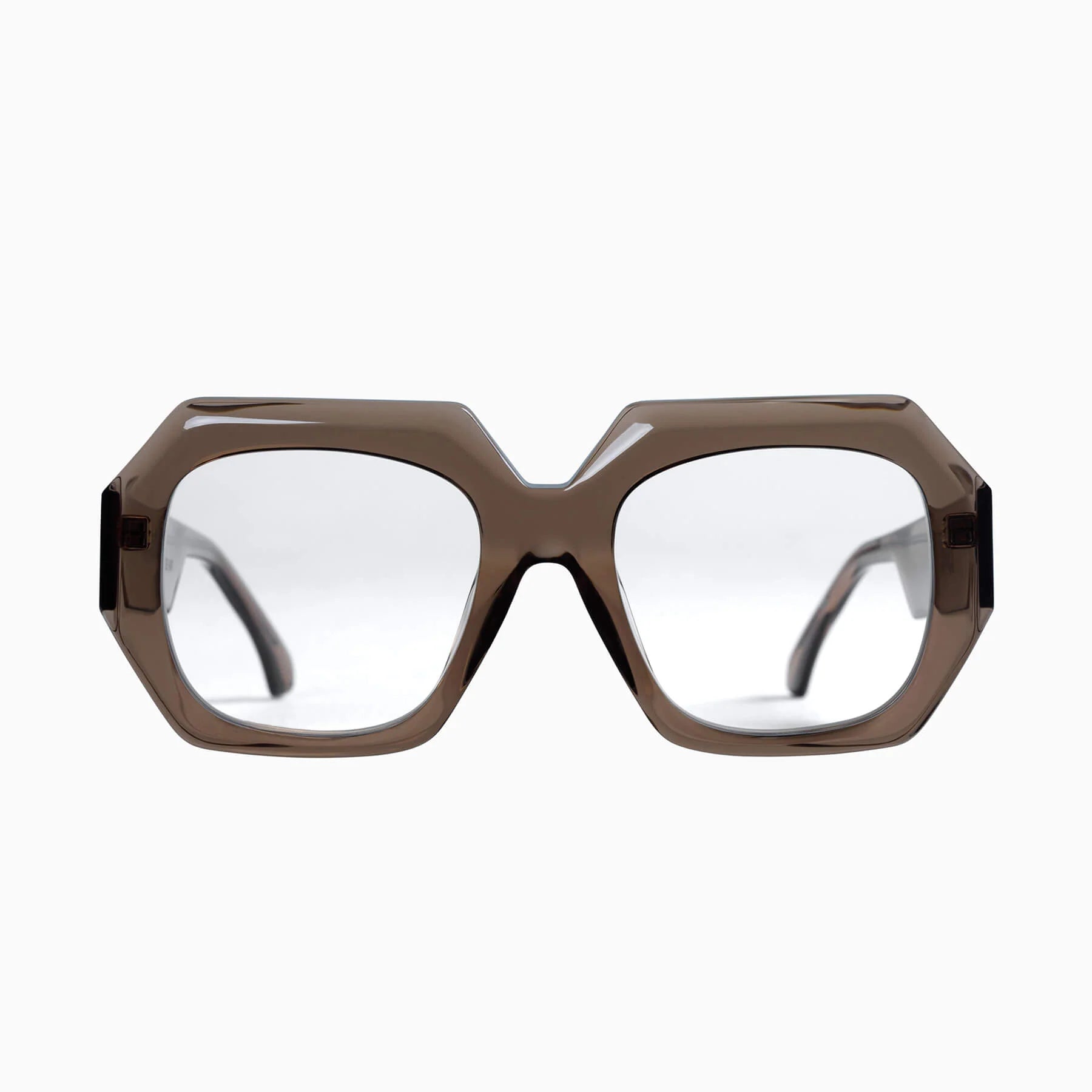 Valley Eyewear Monolith sunglasses with transparent mocha-colored frames and clear lenses, showcasing stylish and modern eyewear design.