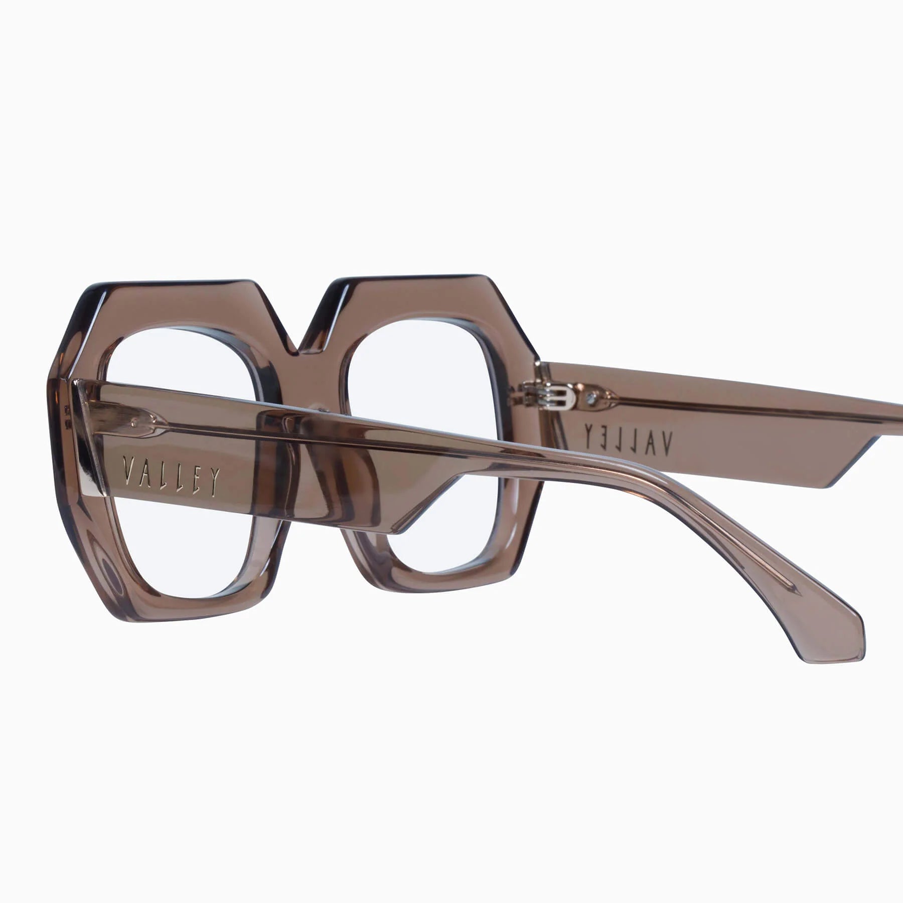 Valley Eyewear Monolith sunglasses with mocha translucent frame and clear lenses, stylish and modern eyewear design.